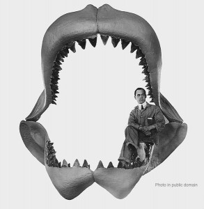 Englishman seated on jaw of megatooth shark.